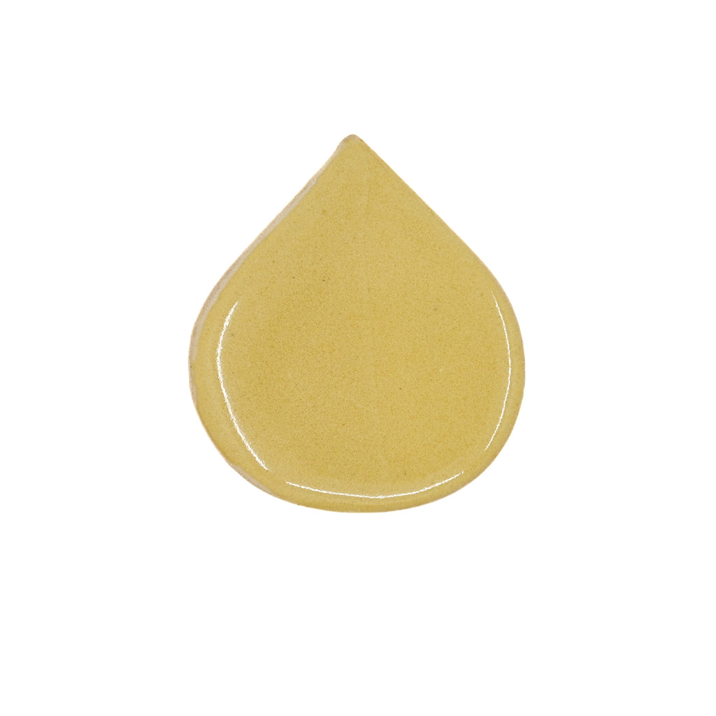 Yellow tear drop shaped tile on white background