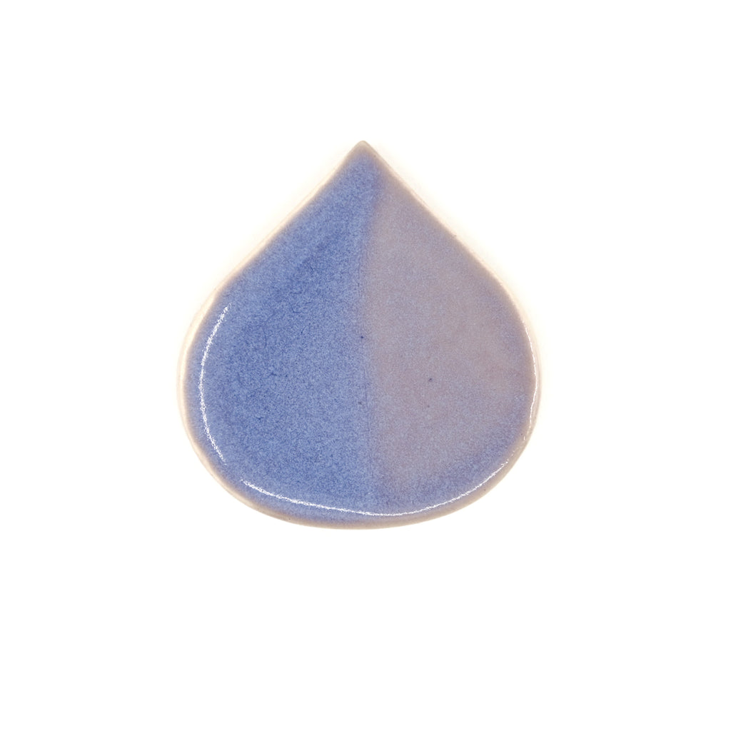 Ceramic teardrop-shaped object with a two-tone blue and beige design on a white background