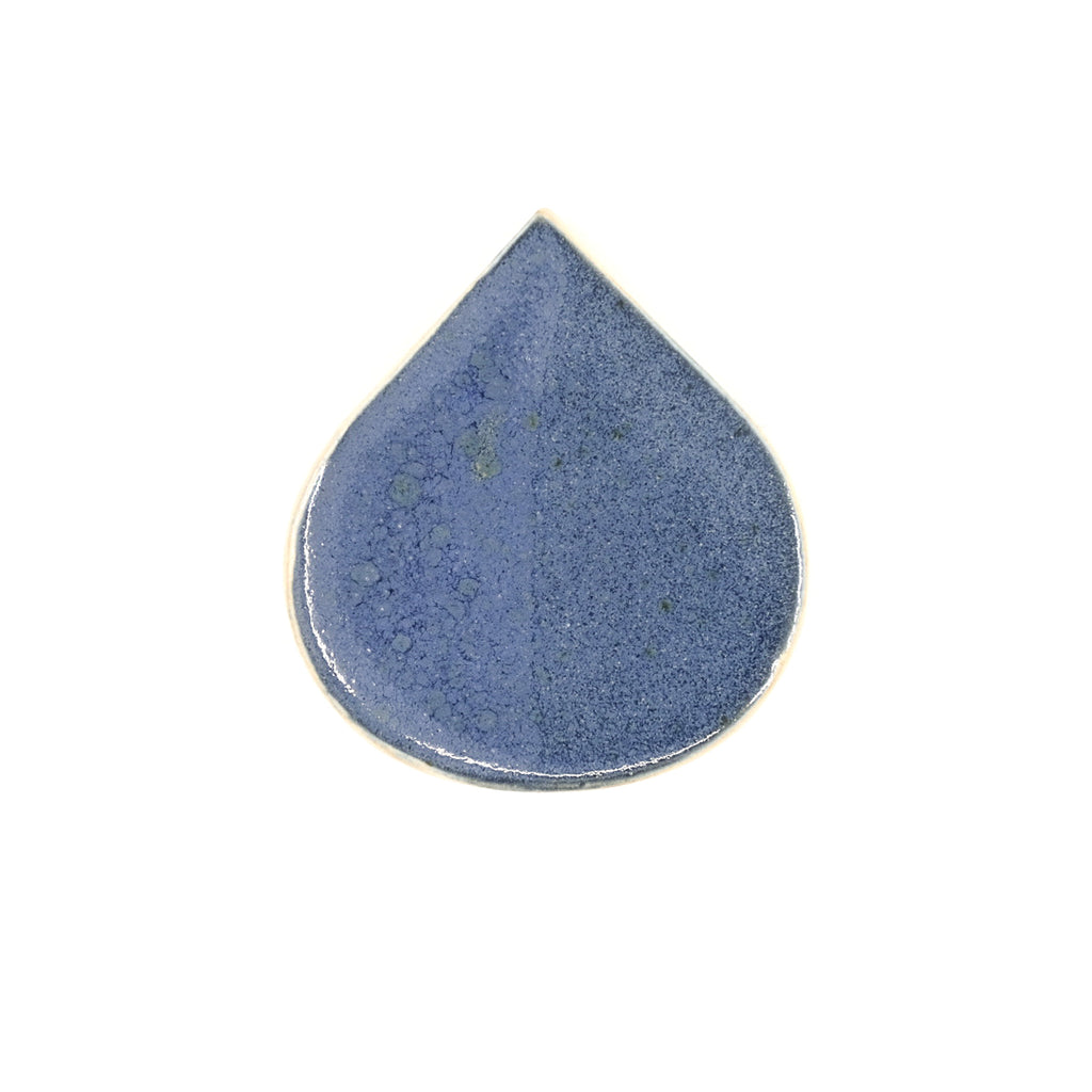 Blue ceramic teardrop-shaped object on a white background